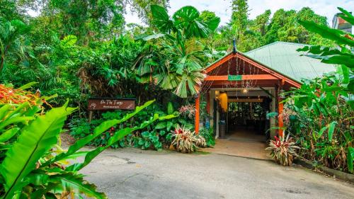 a small building in the middle of a forest at Heritage Lodge - in the Daintree in Daintree