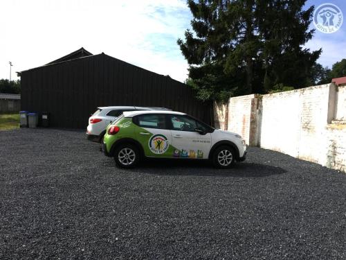 a small car with a sticker on the side of it at Maison Douaisis pour 4 pers avec jardin, terrasse, parking sécurisé et proche tramway - FR-1-510-134 in Aniche
