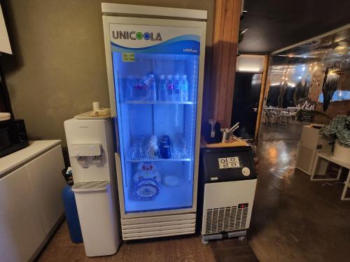 a vending machine with a drink inside of it at 스테이코지해븐 in Ansan
