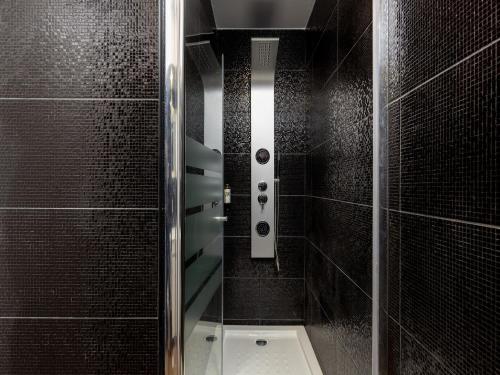 a shower with a glass door in a bathroom at Feel Porto Wine Essence IV in Vila Nova de Gaia