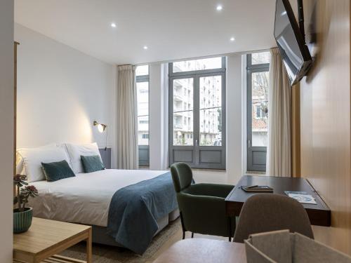 Ένα ή περισσότερα κρεβάτια σε δωμάτιο στο Feel Corporate Housing Marquês I