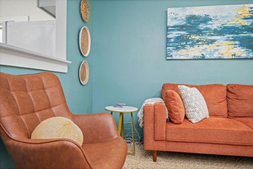 a living room with a couch and a table at The Flats on Florida St - Super Comfy 2-Bedroom Apartments in Mobile
