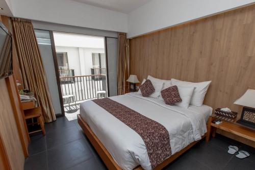 Katil atau katil-katil dalam bilik di Sans Vibes Hotel Seminyak