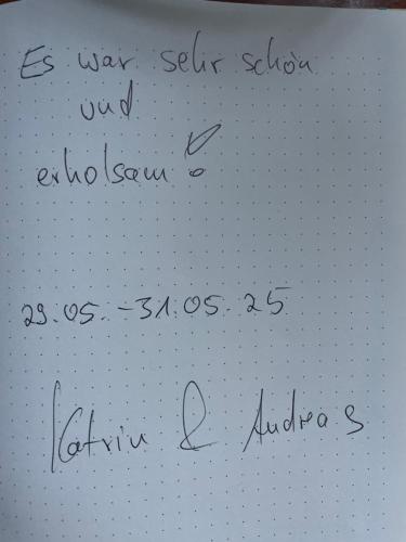 a sheet of paper with handwriting on it at Übernachten im Grünen in Glienicke