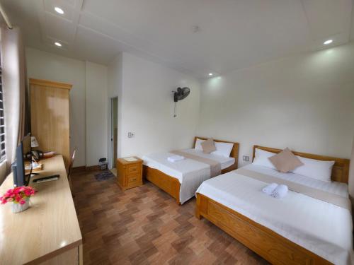 Ένα ή περισσότερα κρεβάτια σε δωμάτιο στο GOLDEN LAND HOTEL