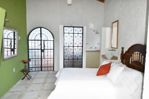מיטה או מיטות בחדר ב-Casa de Zari B&B