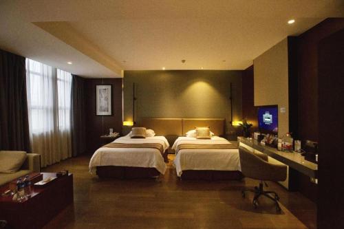 Letto o letti in una camera di Southeast Peninsula Hotel Quanzhou