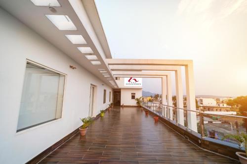 a balcony of a building with a ak sign on it at Eastlynn Resort Rishikesh in Rishīkesh