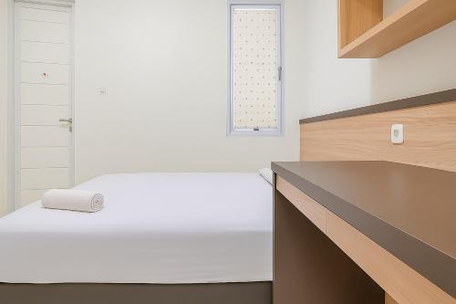Ένα ή περισσότερα κρεβάτια σε δωμάτιο στο Seladarma Cozy Mitra RedDoorz