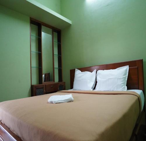 Ένα ή περισσότερα κρεβάτια σε δωμάτιο στο Merina Villa