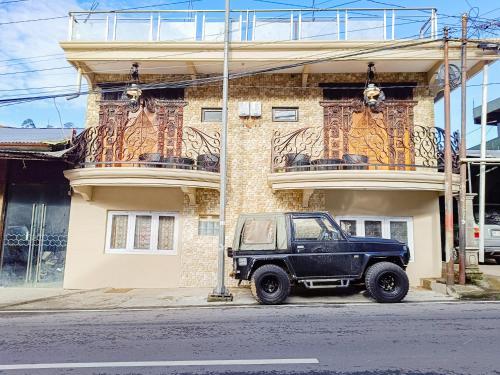 a black truck parked in front of a building at MAHA LIVING Dieng Syariah RedPartner in Dieng