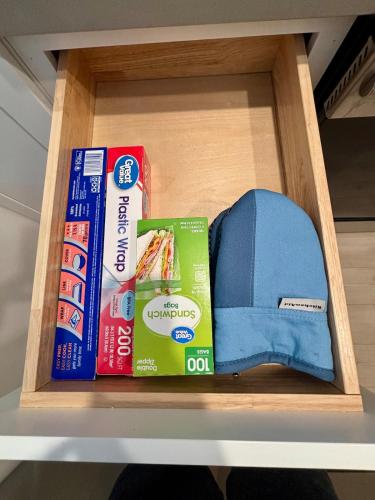 a shelf with books and a hat in a drawer at Stylish Condo in Village Oak Creek with Pool and Hot Tubs in Sedona