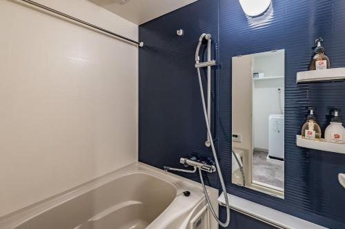 Ένα μπάνιο στο Apartment Hotel 11 Abeno