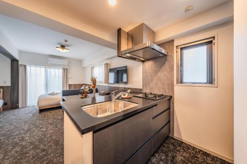 Η κουζίνα ή μικρή κουζίνα στο Apartment Hotel 11 Abeno
