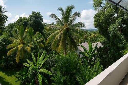a view of a jungle with palm trees at Ranaya Residence Kandy in Kandy