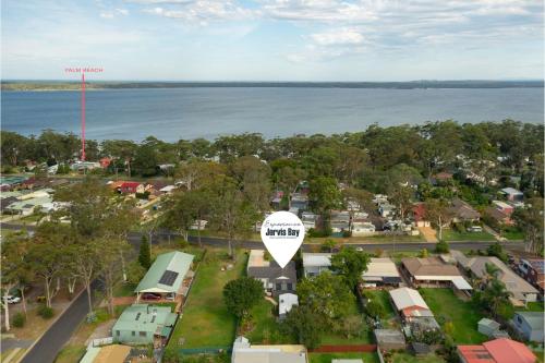 an aerial view of a small town with a lake at Crowford Sands in Sanctuary Point