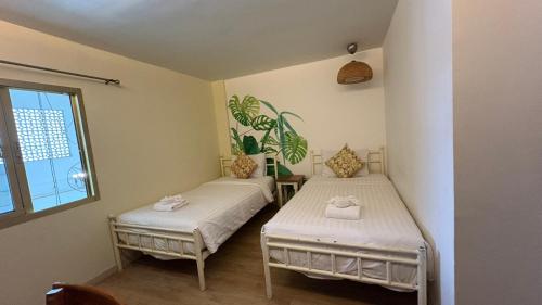 Ένα ή περισσότερα κρεβάτια σε δωμάτιο στο Poshtel Haven Hostel