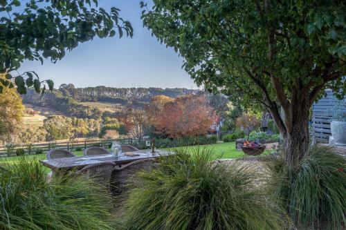 a picnic table in a park with a tree at Serenity in Red Hill - Winery Bliss & Coastal Beauty in Red Hill South