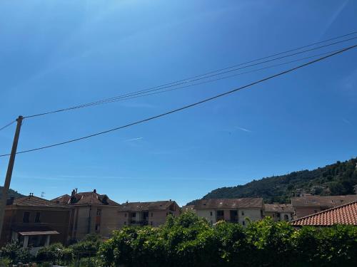 a city with houses and a mountain in the background at Casa Marisa in Camporosso