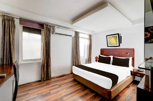 Ένα ή περισσότερα κρεβάτια σε δωμάτιο στο Townhouse Pondicherry Opposite to Rock Beach