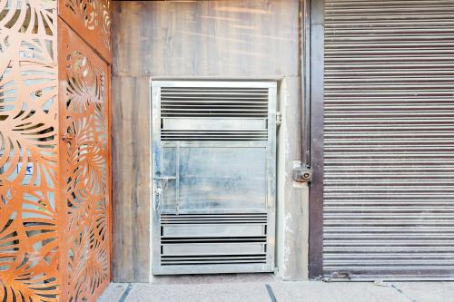 a door in the side of a building at Hotel O Rajeev Nagar Faridabad in Faridabad