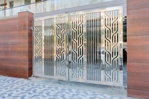 a metal gate on the side of a building at Super Townhouse Sector 1 Manesar in Manesar