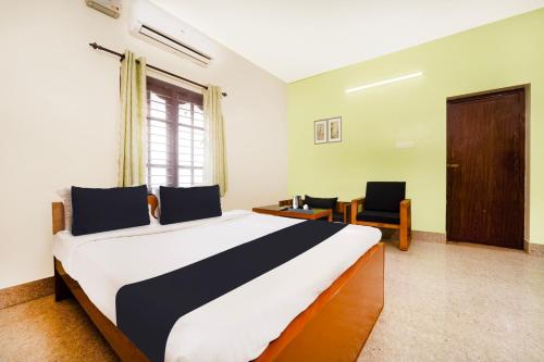 Ένα ή περισσότερα κρεβάτια σε δωμάτιο στο Hotel O Singanallur Coimbatore