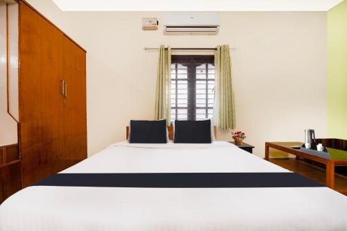 Ένα ή περισσότερα κρεβάτια σε δωμάτιο στο Hotel O Singanallur Coimbatore