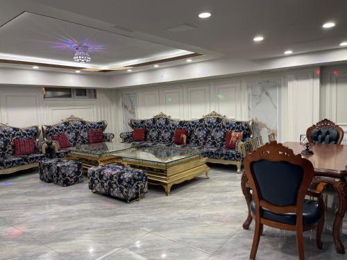 a large living room with couches and a table at Numt Guren Resort in Ulaanbaatar