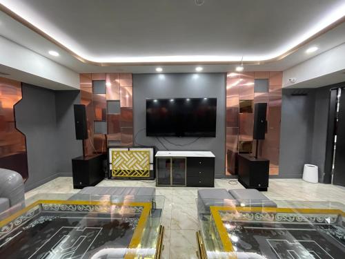 a living room with a flat screen tv on a wall at Numt Guren Resort in Ulaanbaatar