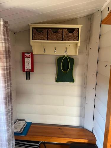 a bench in a tiny house at Home From Home LogCabin in Trawsfynydd