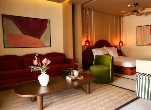 a living room with a couch and a bed at Casa Fontana in Alacati