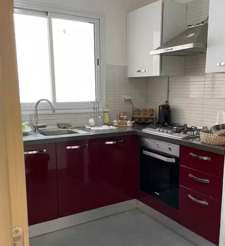 Η κουζίνα ή μικρή κουζίνα στο Appartement menzah9
