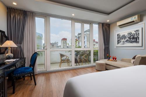 Postel nebo postele na pokoji v ubytování Golden Amour Hotel