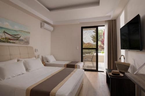 Postel nebo postele na pokoji v ubytování Hotel Rema