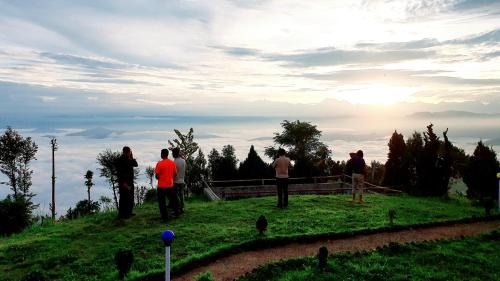 a group of people standing on top of a hill at Mundum Farm Stay in Dhulikhel