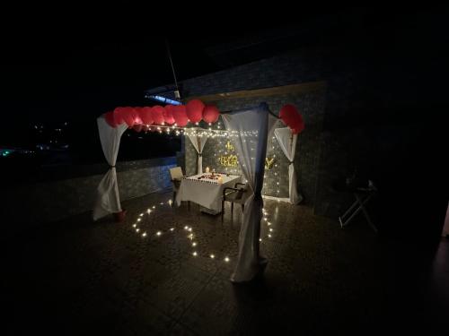a table set up for a party at night at Hotel Sand Heaven in Port Blair