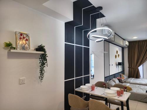 a dining room with a table and chairs at TR12 tulip elmina 5pax Big cinema movie 1 free parking in Shah Alam