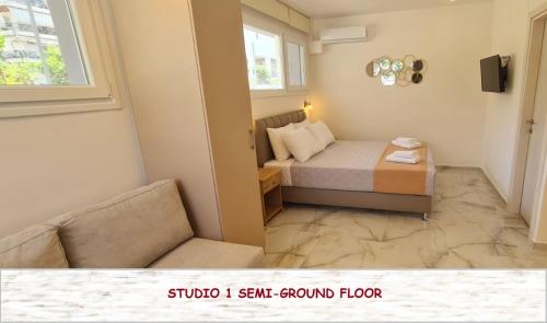 a small bedroom with a bed and a window at Z Elegant Studios in Perea