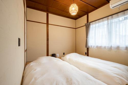 別府 竹風ーBeppu Takekazeにあるベッド