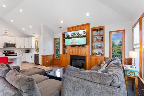 a living room with two couches and a fireplace at 3057 - Olive the Beach in Southern Shores