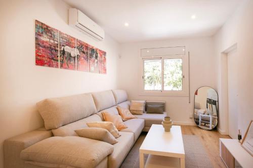 a living room with a couch and a table at Lovely apartment with 3 bedroom in Cornellà de Llobregat