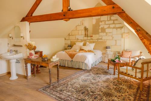 Ένα ή περισσότερα κρεβάτια σε δωμάτιο στο Manoir saint Eusèbe