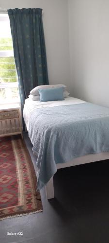 Ein Bett oder Betten in einem Zimmer der Unterkunft Oppikoppi De Kelders