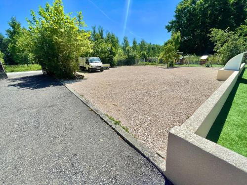 a large parking lot with a truck parked in it at " Ô Chai Nous " 14 pers - Billard, Babyfoot - Structure de Jeux in Poucharramet