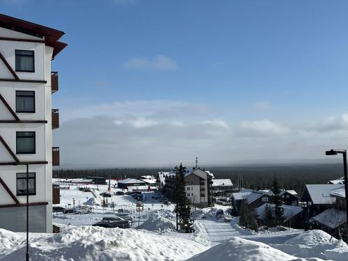 a city covered in snow with a building at Ylläs Chalet 4 Ski-In, Incl 2 winter lift passes in Ylläsjärvi