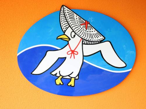 a sticker of a bird wearing a sombrero at Ryokan Kamomeso in Sado