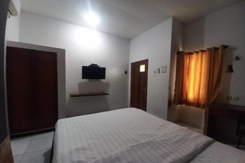 Кровать или кровати в номере OYO 94633 S_qyu Stay