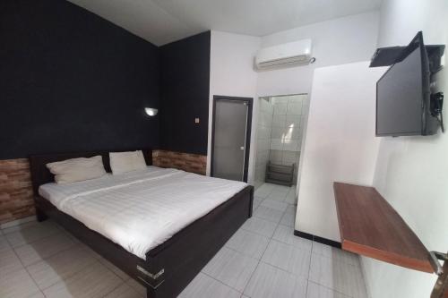 Кровать или кровати в номере OYO 94633 S_qyu Stay