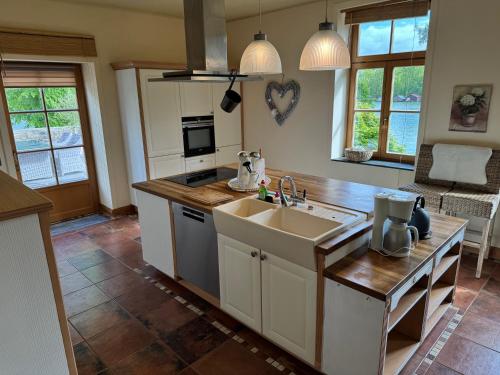 a kitchen with a sink and a counter top at Drostenhaus Feldberg in Feldberg
